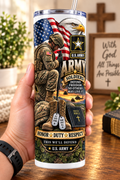 Hand holding a straight-sided 20 oz tumbler with Patriotism Army 1 artwork on a warm wood counter