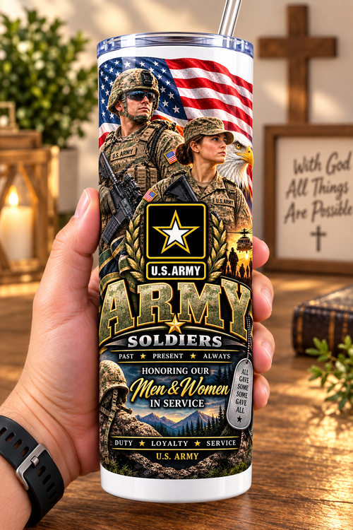 Hand holding a straight-sided 20 oz tumbler with Patriotism Army 2 artwork on a warm wood counter