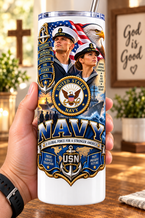 Hand holding a straight-sided 20 oz tumbler with Patriotism Navy 3 artwork on a warm wood counter