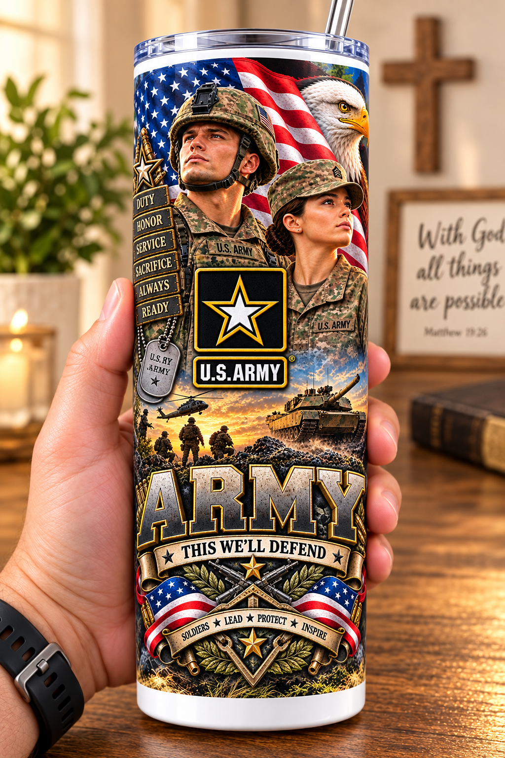Hand holding a straight-sided 20 oz tumbler with Patriotism Army 4 artwork on a warm wood counter